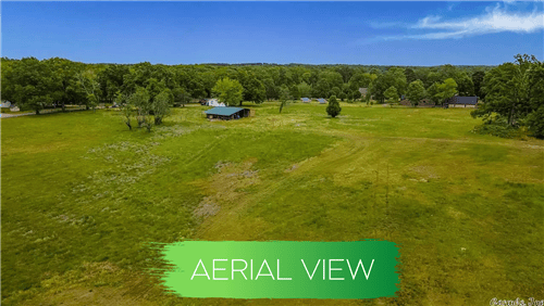 Aerial view of Lot 8, Block 1 on 0.52-acre parcel in Saline County, Arkansas Hot Spring Village, showing surrounding land and trees.