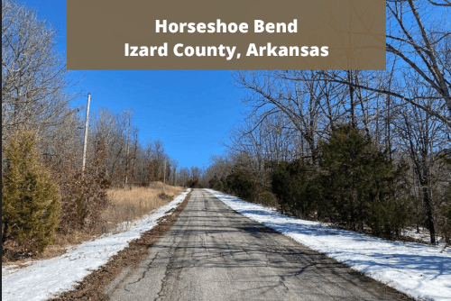 Aerial view of Arkansas Izard County 0.44-acre lot in Horseshoe Bend, with trees and open land, offered by Onlinelandsales.