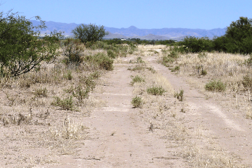 Aerial view of Arizona Sunsites Lot 01 in Cochise County, 1.41-acre property with desert landscape and surrounding land.
