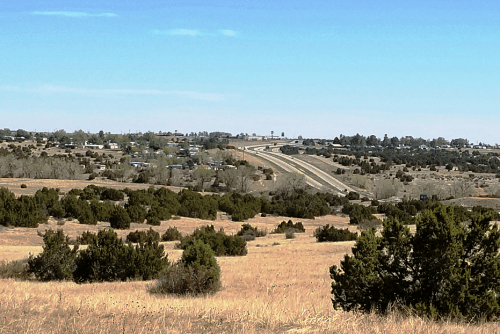 Aerial view of Colorado Pueblo County 1.71-acre property lot 181 in Colo City Unit 31, showing surrounding land and roads.