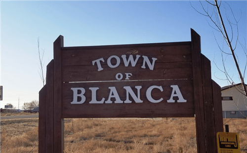 Aerial view of Colorado's Costilla County Blanca Town Lot 6 Block 115, 0.16-acre land parcel with surrounding landscape.