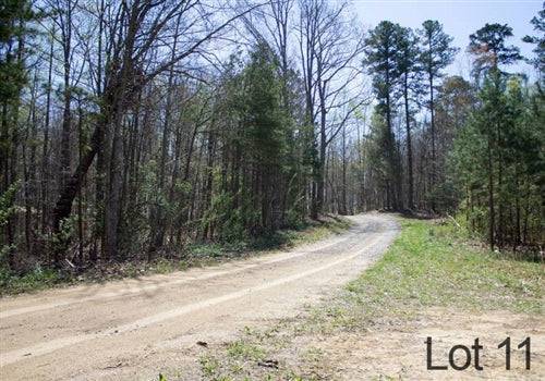 Aerial view of Kentucky Rock Castle County 10.02-acre Chestnut Oak Ridge Lot 11, showcasing wooded land with natural terrain.
