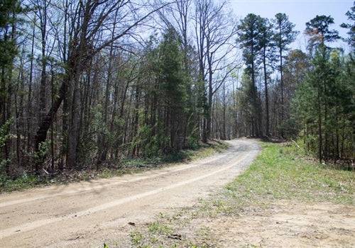 Aerial view of Kentucky Rock Castle County 11.54-acre Chestnut Oak Ridge lot 16 in RockCastle, showing wooded landscape and terrain.