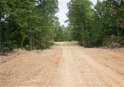 Aerial view of Buck Run Ridge Lot 7 in Wayne County, Kentucky, showing wooded 12.58-acre property with natural landscape.