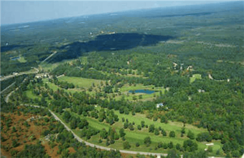 Aerial view of Michigan Antrim County Lake of the North lot 746, 0.5 acres with nearby electricity and water access, offered by Onlinelandsales.