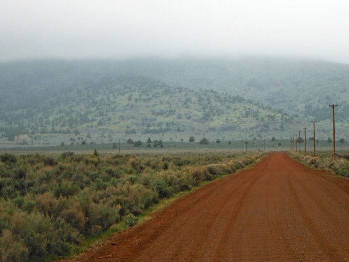 Aerial view of 20-acre Moon Valley Ranch Lot 373 in Lassen County, California, showcasing the rural landscape and surrounding land.