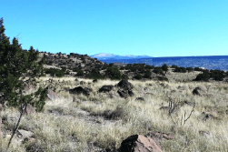 Aerial view of 1.33-acre lot in Cibola County, New Mexico, showing open land with surrounding natural landscape and property boundaries.