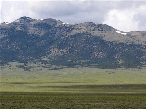 Aerial view of Nevada Elko County Mountain Meadow Ranches parcel 846 showing open meadows and surrounding mountains.