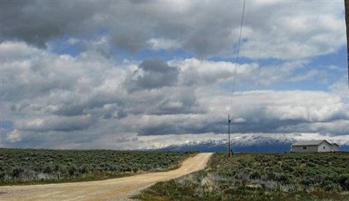 Aerial view of Nevada Elko County Twin River Ranchos Lot 7, 2.27-acre property with open land and surrounding natural landscape.