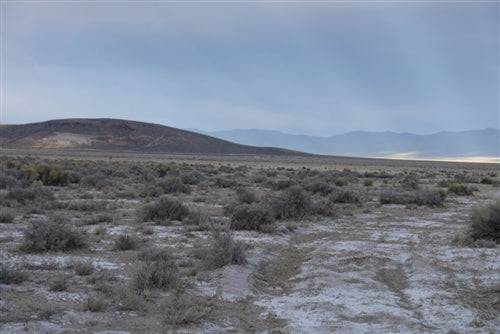 Aerial view of Nevada Eureka County Crescent Valley 4.54-acre lot in Unit 4, Block 19, Lot 3, showcasing open desert landscape.
