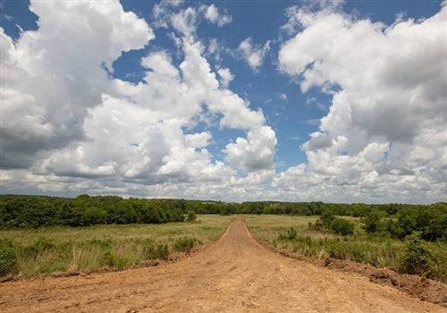 Aerial view of Pittsburg County Paradise Valley lot 14 in Oklahoma, showing open land and scenic natural surroundings.