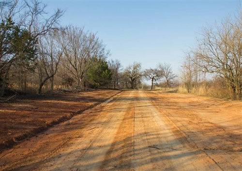 Aerial view of Oklahoma Pittsburg County 9.77-acre Eufaula Estates Lot 20 with visible land, trees, and open space.