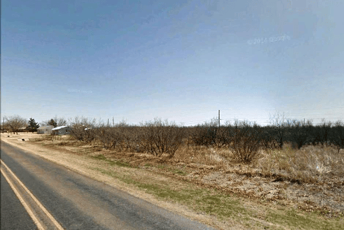 Aerial view of four adjoining Texas Hardeman County Quanah lots on Block 10, with visible electrical hookups and open land.