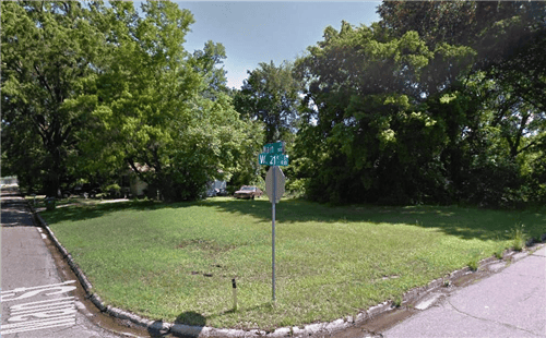 Aerial view of a 0.15-acre Texas lot in Bowie County, Texarkana, Lot 37 Block 8, with nearby roads and land features.