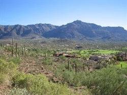 Aerial view of Arizona Mohave County land in Kingman with desert landscape, showcasing .07 acre plot for sale by Onlinelandsales.