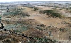 Aerial view of a 1.25-acre land parcel in Mohave County near Lake Havasu, with desert landscape and open sky.
