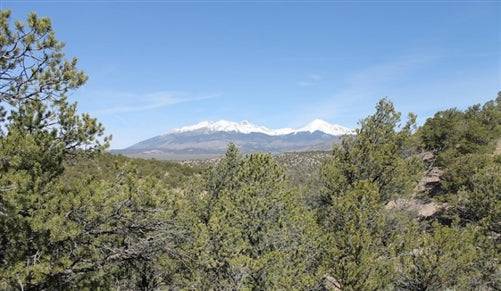 Aerial view of Colorado's Costilla County showing a 5.14-acre property in Sangre De Cristo Ranches, with surrounding natural landscape.