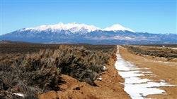 A scenic view of Colorado Costilla County San Luis Valley Ranches Lot 11, showing open land and surrounding natural landscape.