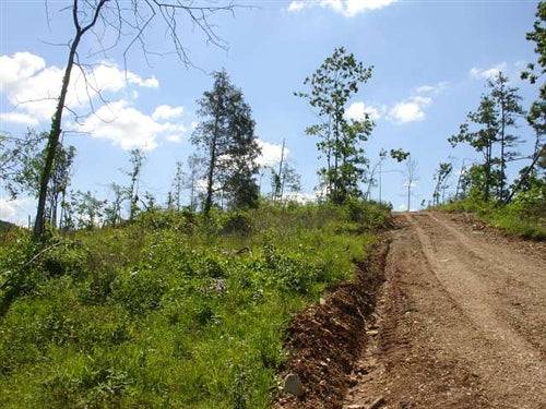 Aerial view of Missouri Shannon County 20.35-acre Antler Ridge property with wooded terrain and scenic landscape.