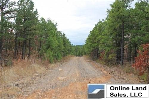 Aerial view of Indian Ridge 15.8-acre land in Pittsburg County, Oklahoma, with natural landscape and wooded areas.