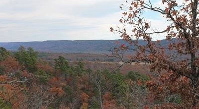 Aerial view of Oklahoma Pittsburg County 10.67-acre Indian Ridge I land for sale, featuring natural terrain and wooded areas.
