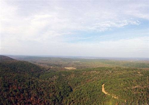 Aerial view of Indian Ridge III Creek property in Pittsburg County, Oklahoma, showcasing wooded 19.43-acre land parcel.