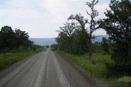 5-acre mountain view ranch with pond in Pushmataha County, Oklahoma, showing scenic landscape and rural land features.