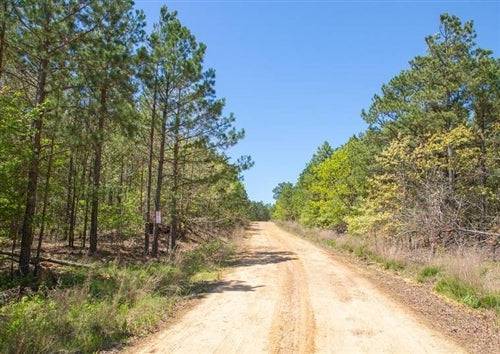Aerial view of Eagle’s Nest Lot 27 in Pushmataha County, Oklahoma, showcasing 6.56 acres of wooded land.