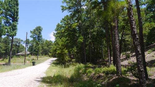 Aerial view of Texas Bastrop County Tahitian Village Resort lot 126, a 0.25-acre property in Bastrop, Texas.