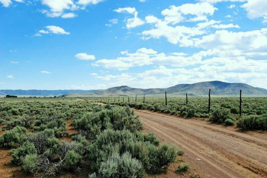Aerial view of Utah Iron County Garden Valley Ranchos Unit 5 Lot 2587, showing open land and surrounding natural terrain.