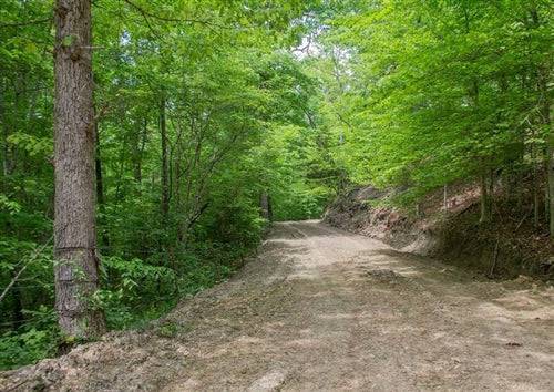 Aerial view of Kentucky Casey County Laurel Ridge 7.75-acre Lot 10 with wooded landscape and open land in Kentucky.