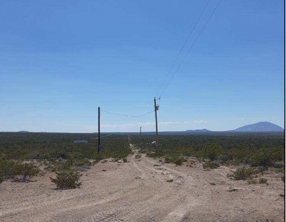 Aerial view of Texas Hudspeth County eastern hills land lot 10, 0.14 acres, showing natural terrain and surrounding landscape.