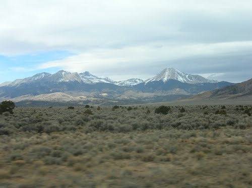Aerial view of a .25 acre lot in Sangre de Cristo Estates, Costilla County, Colorado, with surrounding natural landscape and open land.