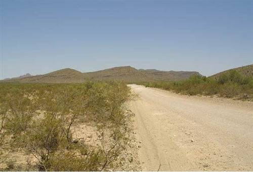 Aerial view of Texas Hudspeth County Sunset Ranches Lot 6, 20-acre property with scenic desert landscape and clear blue sky.